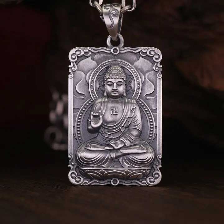 A rectangular pendant depicting The Buddha