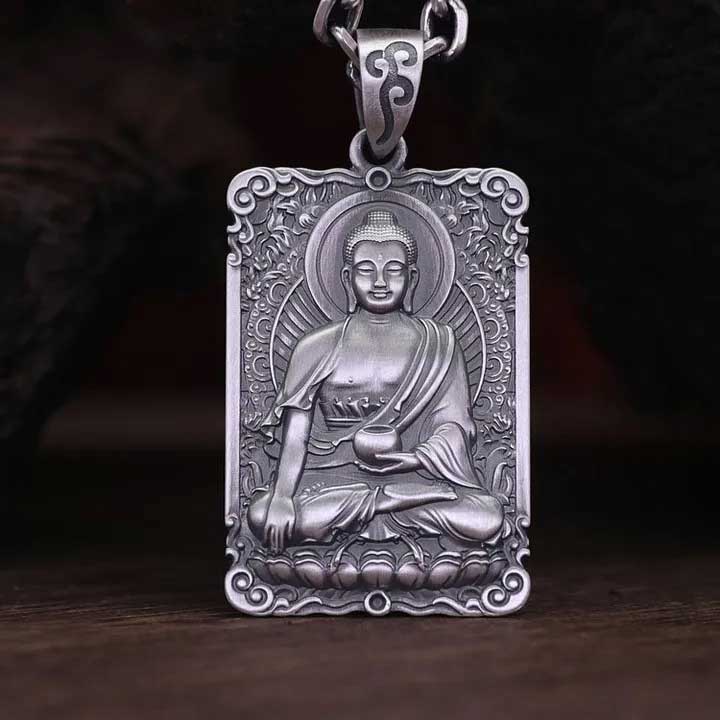 A rectangular pendant depicting the Medicine Buddha