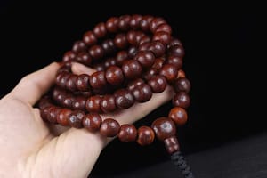 Someone holding an old Tibetan Bodhi seed mala