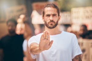 Man holding out the palm of his hand