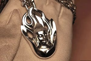 A newly crafted pendant of the Buddha engulfed in flames (fmales of awareness)